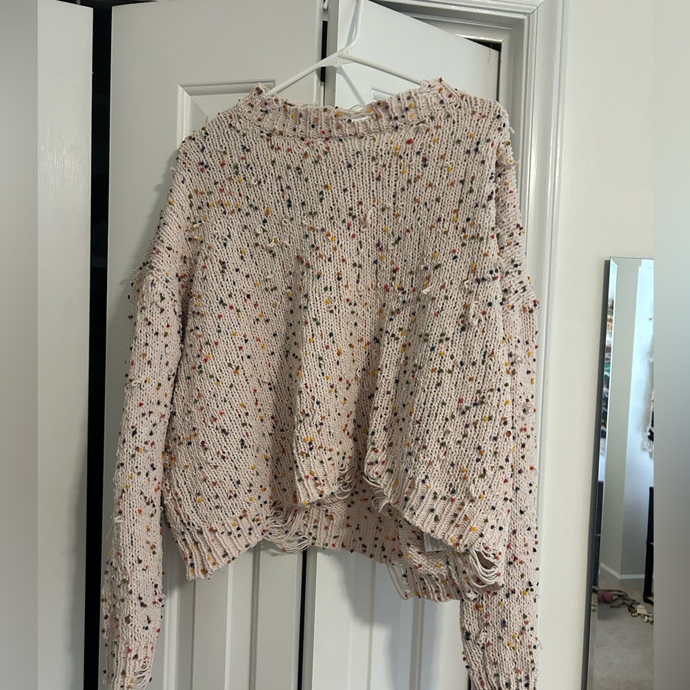 White sweater with rainbow flecks